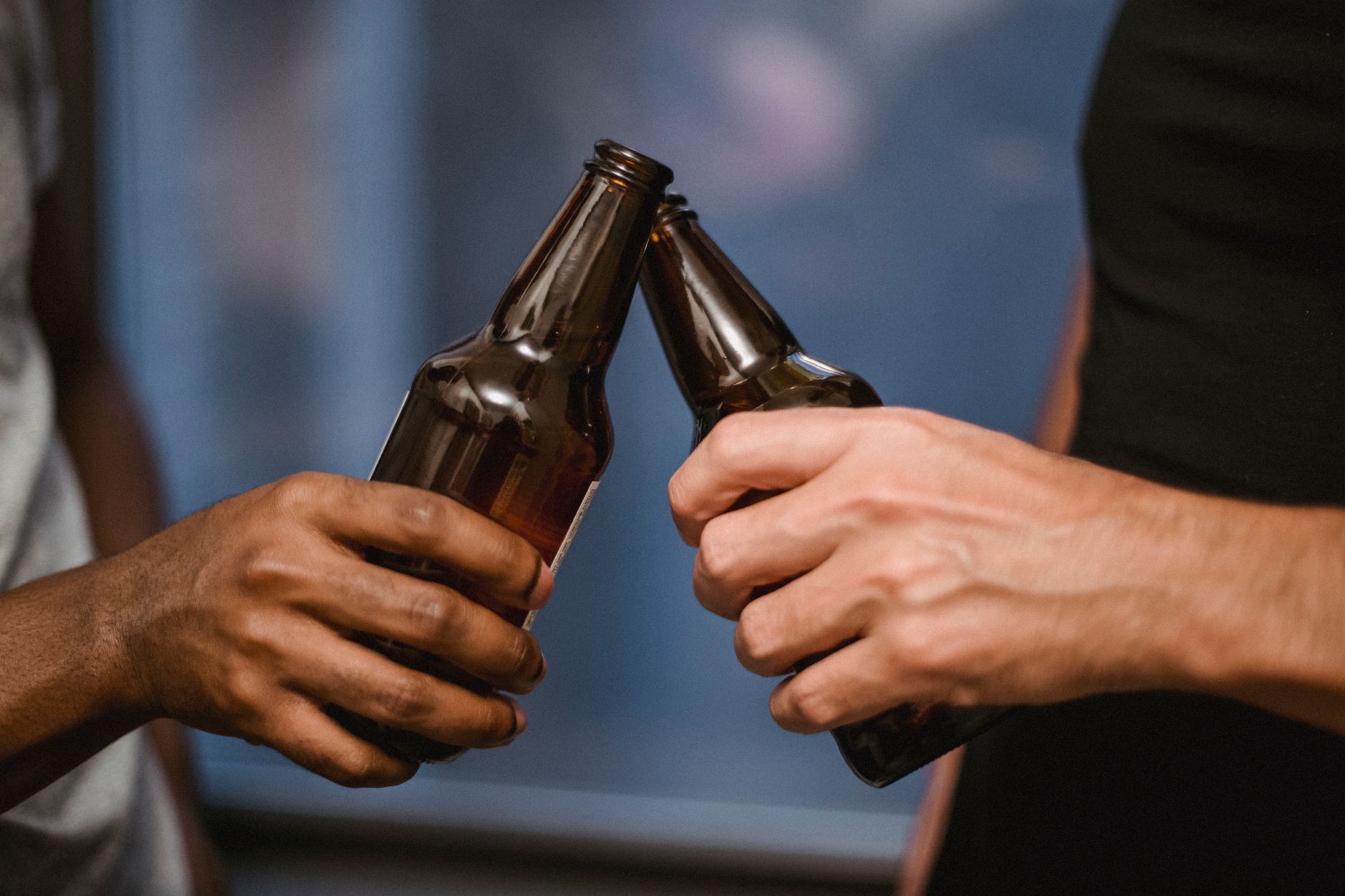 beer bottles in hands